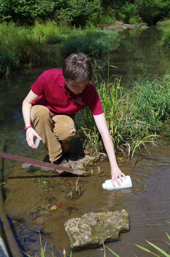 Pearl Webb sampling water- downstream site